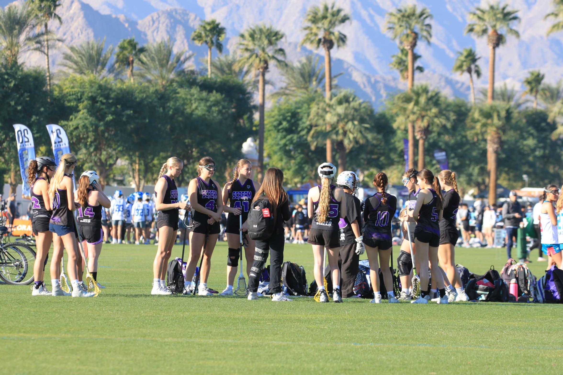 Scream team on the sideline with mountains backdrop